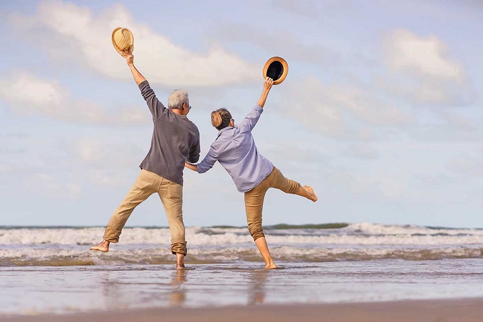 Couple enjoying a peaceful walk in nature, representing overall wellness and an active lifestyle